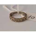 A white gold and diamond 9 stone ring, 18ct, size K, 3.9 g.