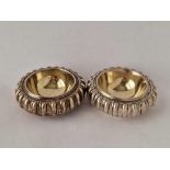 A pair of heavy Victorian Britannia standard silver trenchers salts with fluted sides and gilded