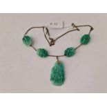 A carved green stone vintage necklace