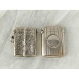 Two vesta cases, one engraved with scrolls on ribbed body, Birmingham 1908 by G&F