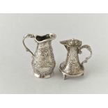 Two miniature Dutch jugs with chased sides, 1.5” high