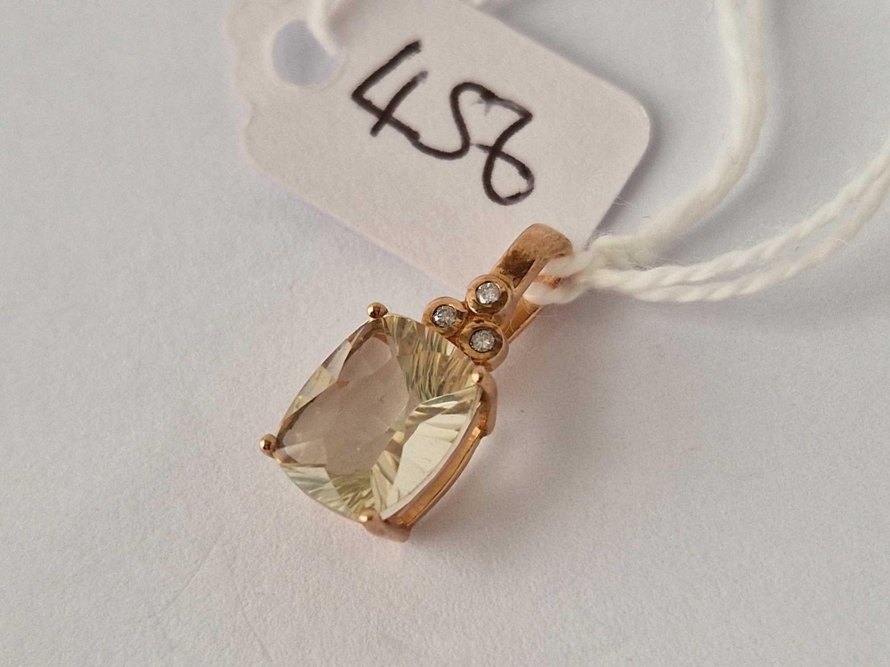 A rose gold three stone diamond and large stone pendant