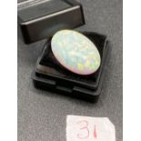 A large synthetic fiery oval opal 9ct