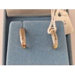 A pair of boxed diamond half hoop earrings 9ct 2.5 gms