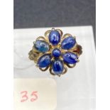 A 1960s flower cluster dress ring set with cabochon sapphires 9ct