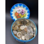 Interesting tin of world coins
