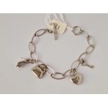 A white gold charm bracelet 9ct 7.5 inch 9 gms