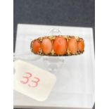 A fine antique coral five stone ring 9ct in period gold mount.
