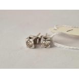 A PAIR OF BOXED WHITE GOLD DIAMOND EARRINGS EACH .20 CARAT 18CT GOLD 2.7 GMS