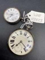 A silver pocket watch and fob watch