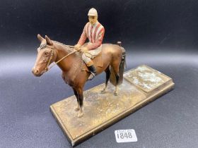 A painted table lighter in the form of a horse and jockey 10 inches long