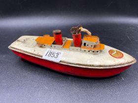 A clockwork boat 9 inches long