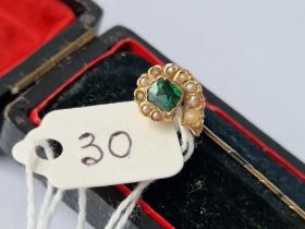 A boxed green stone and pearl stick pin