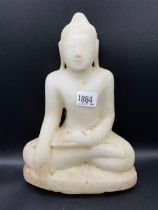 An antique carved alabaster seated Buddha 11 inches high