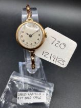 A ladies wrist watch 9ct and 9ct expandable strap and 9ct dust cover marked AB