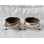 A pair of Georgian salts each on three pad feet, 2.5” diameter, probably London 1754 112 g.