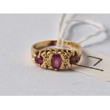A ruby and diamond seven stone ring 18ct gold size K 3.2 gms