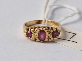 A ruby and diamond seven stone ring 18ct gold size K 3.2 gms