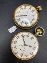 Two large metal eight day pocket watches one with seconds dial and one by Goldsmiths and