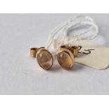 A pair of oval gold set stone earrings 1.3 gms