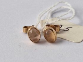 A pair of oval gold set stone earrings 1.3 gms