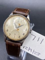 A gents stainless steel OMEGA wrist watch engraved 1955 to reverse with seconds sweep and leather