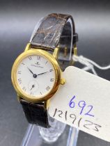 A JAEGER LE COULTRE WRIST WATCH 18CT GOLD WITH SECONDS DIAL SIGNED TO THE BACK GENTILHOMME No 0166