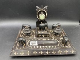 A Middle Eastern instand/ watch stand with elephants 12 inches wide