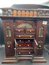 A Victorian table cabinet of drawers and gallery rim