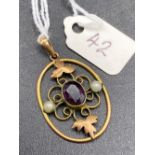A Victorian amethyst and pearl decorated gold pendant
