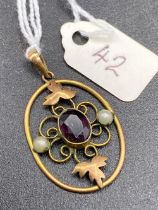 A Victorian amethyst and pearl decorated gold pendant