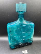 A retro glass decanter and cover