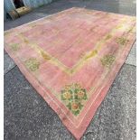 A heavy pile pink ground carpet, 15ft x 12 ft