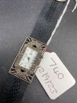 A silver and marcasite wrist watch