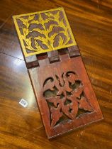 An Eastern folding pierced and painted gilt wood book holder