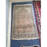 An oriental rug with vase of flowers motif, 6ft 4" x 3ft 10"