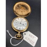 A rolled gold WALTHAM hunter pocket watch with seconds dial cracked glass W/O