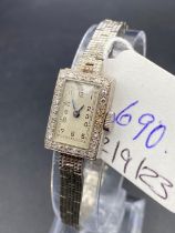 A GOOD WHITE GOLD DIAMOND SET LADIES WRIST WATCH WITH INTEGRAL LINK STRAP ALL 9CT 23.7 GMS INC.