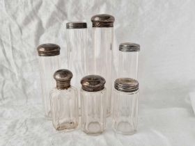 Seven various silver top jars, London 1905 etc