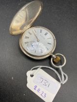 A silver pocket watch with WALTHAM movement W/O