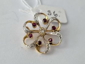A PRETTY DIAMOND AND RUBY BROOCH 18CT GOLD 5.3 GMS