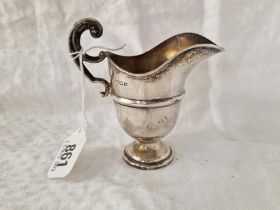 A helmet shaped cream jug of George I design, scroll handle, 4" high, 55g