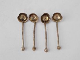A set of four small salts spoons with ball finials, London 1909