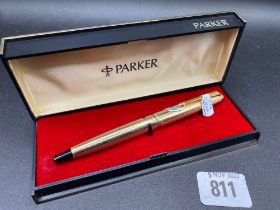 A Parker INSIGNIA Gold fled pen and a Parker 61 Gold colour and matching Ball point pen