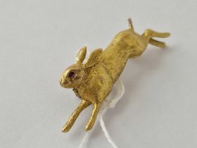 A VICTORIAN NOVELTY RUNNING RABBIT BROOCH WITH RUBY EYES 18CT GOLD TESTED 11.4 GMS