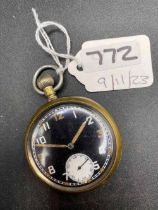 A black faced military pocket watch with seconds dial stamped on reverse G S T P F161109