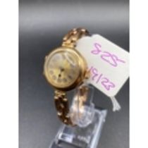 A LADIES WRIST WATCH WITH 9CT EXPANDING STRAP 9CT 23.3 GMS INC.