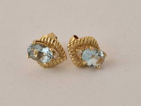 A pair of aquamarine ear studs 14ct gold 2 gms