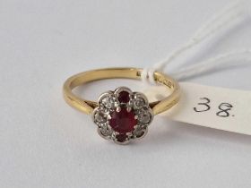 A Ruby And Diamond Cluster Ring 18Ct Gold Size O 3 Gms