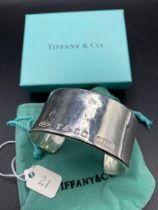 A Tiffany And Co Silver Bangle In Tiffany Box 109 Gms